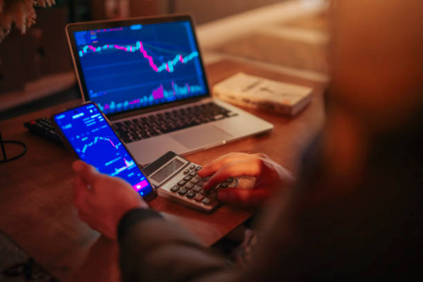 istock Financial data concept. Analyzing cryptocurrency and financial data in the computer monitor with using smart phone 1372599723
