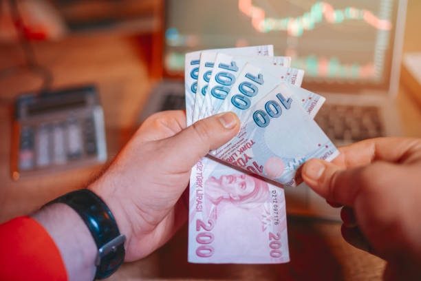 Unidentified hand counting Turkish money stock photo