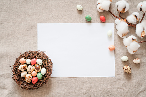 Easter composition on a textured beige linen background