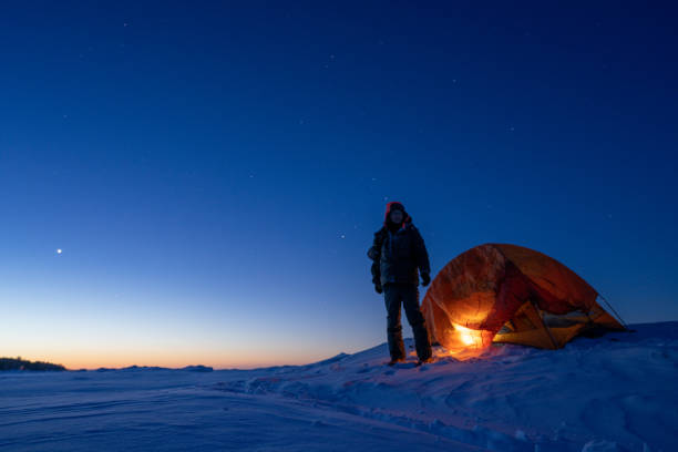 istock man camping in ice lake in winter 1372605062