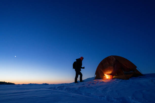istock man camping in ice lake in winter 1372605241