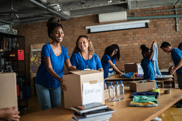 istock Volunteers arranging donations in a community center 1372606791