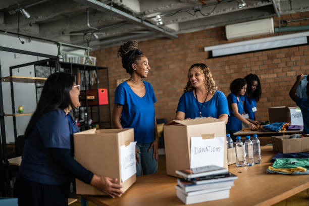 istock Volunteers arranging donations in a community center 1372606809