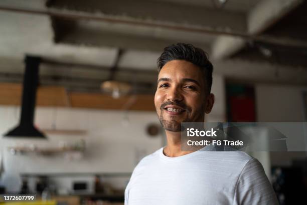 Portrait Of A Mid Adult Man At Home Stock Photo - Download Image Now - Dental Braces, Adult, Smiling