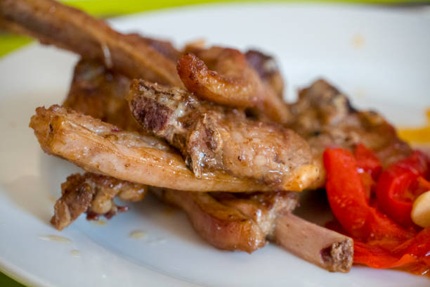 istock Grilled Lamb Chops with red peppers on plate Spain 1372609783