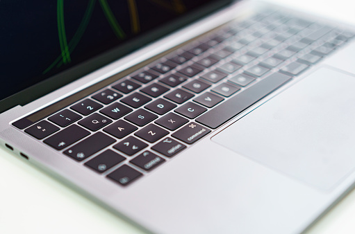 Close up view of a laptop on a the desk, shallow depth of field