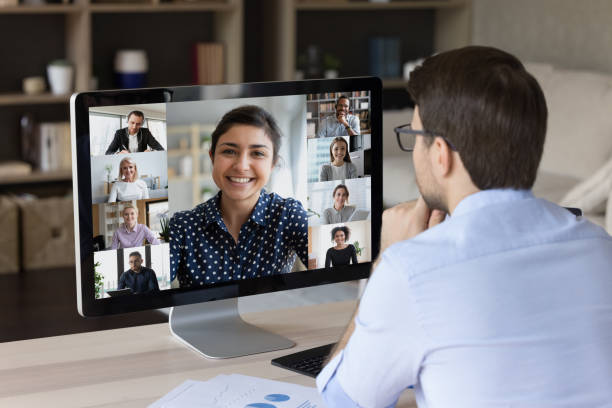 istock Millennial remote worker watching online business conference 1372613478