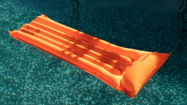 istock inflatable mattress floating on water surface. Lifebuoy. vacation concept. 1372613665