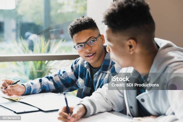 Male High School Friends Studying Together Stock Photo - Download Image Now - High School Student, Teenager, Classroom