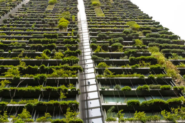 istock Low angle view of apartment building with vertical gardens, background with copy space 1372615774