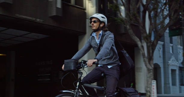 istock Professional Man Riding E-Bike to Work 1372618737