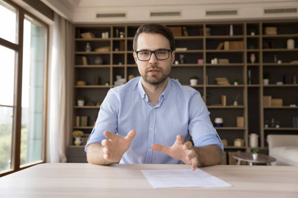 istock Serious confident millennial business professional in glasses looking at camera 1372619035