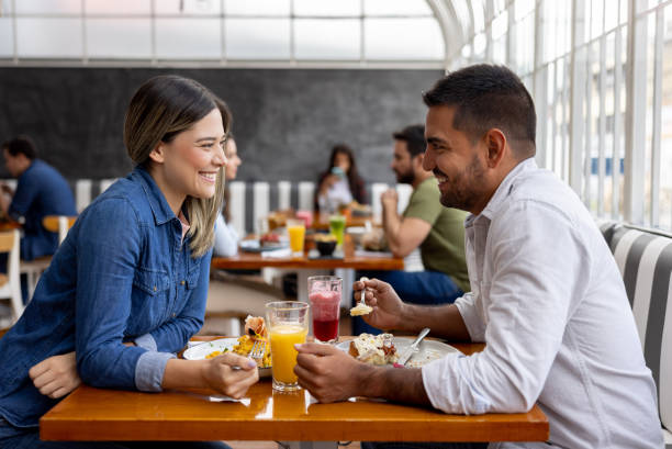istock Happy couple on a date at a restaurant 1372627977