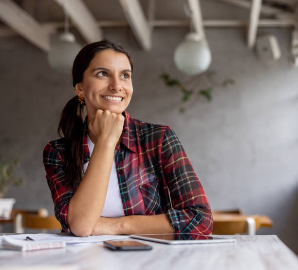 istock Restaurant owner thinking about how to expand her small business 1372628020