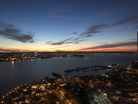 Aerial view of naval ship travelling in San Diego Bay, San Diego, California, USA.