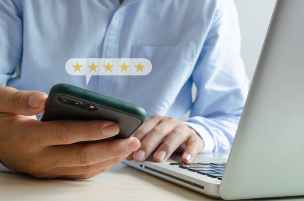 Customer service concept excellent service for satisfaction five star rating with business man holding smart phone.positive thinking and customer feedback. stock photo