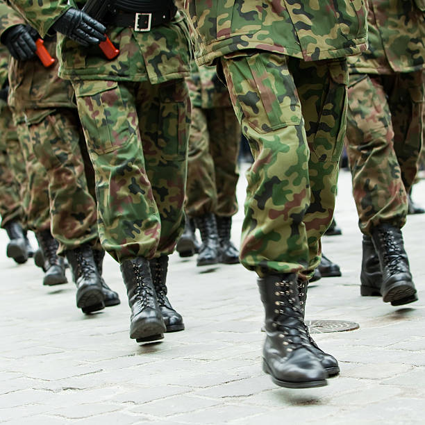 istock Soldiers marching in unison on cobblestone 137263509