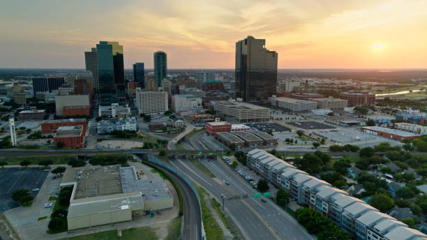 istock Car Driving into Fort Worth at Sunset - Drone Shot 1372638524