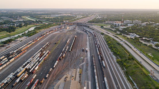 Drone shot of a freight train yard and locomotive depot in Fort Worth, Texas.