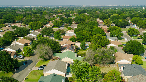 Aerial shot of of suburban streets in Fort Worth, Texas on a sunny day in summer.