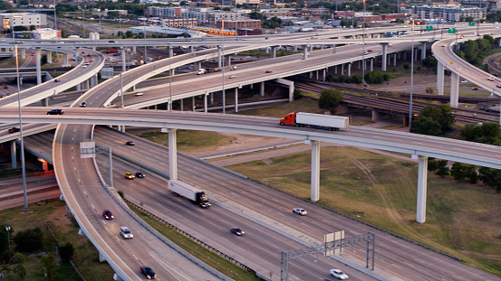 Aerial shot of a freeway interchange in Fort Worth, Texas at sunset.