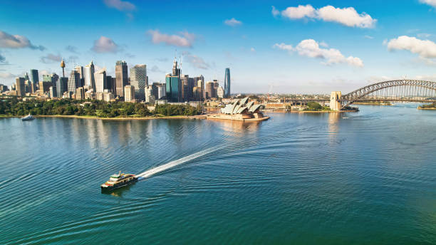 istock Ferry Sailing Through Sydney Harbour with Opera House and Bridge in Background 1372641579