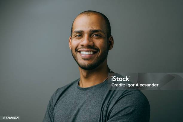 Portrait Of A Businessman On Gray Background Stock Photo - Download Image Now - Men, Portrait, African-American Ethnicity