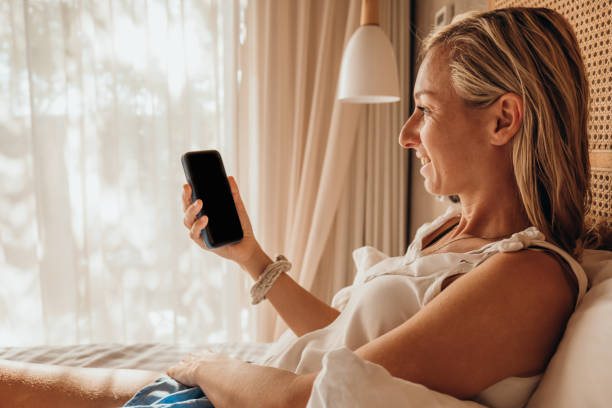 istock Young woman checking her mobile phone 1372641789