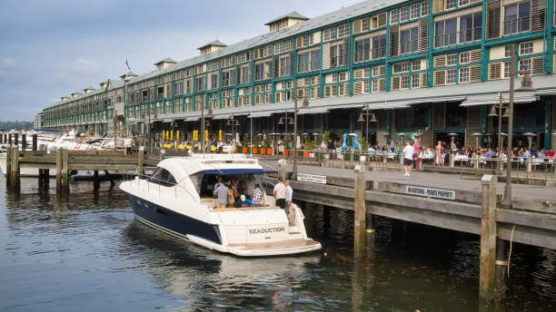 Sydney, New South Wales Australia - December 23 2022: Passengers disembarking a hire boat at Finger Wharf , Woolloomoolo Sydney Australia