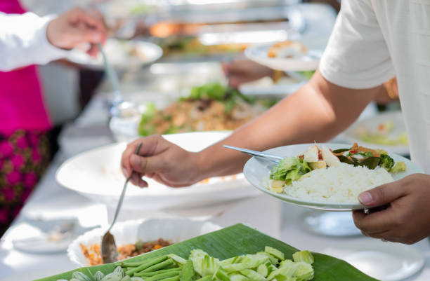 istock scooping the food, catering, dinner time 1372647508