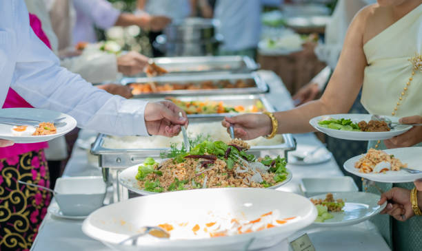 istock scooping the food, catering, dinner time 1372647510