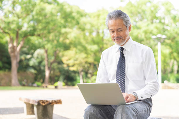 istock asian businessman using laptop 1372659243