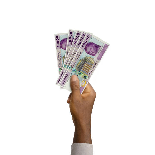 istock Black Hand holding 3D rendered 10000 Central African CFA franc notes 1372665946