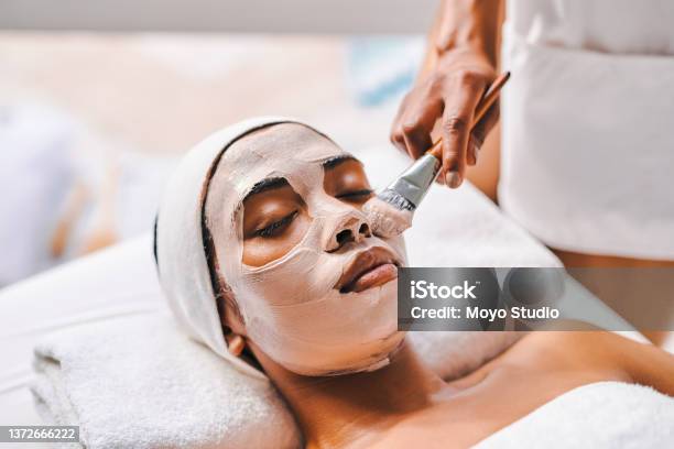 Shot Of An Attractive Young Woman Getting A Facial At A Beauty Spa Stock Photo - Download Image Now