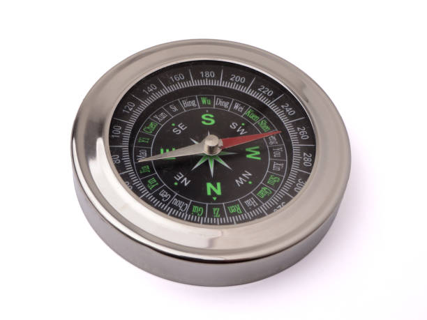istock Magnetic silver metal compass on white background 1372670692