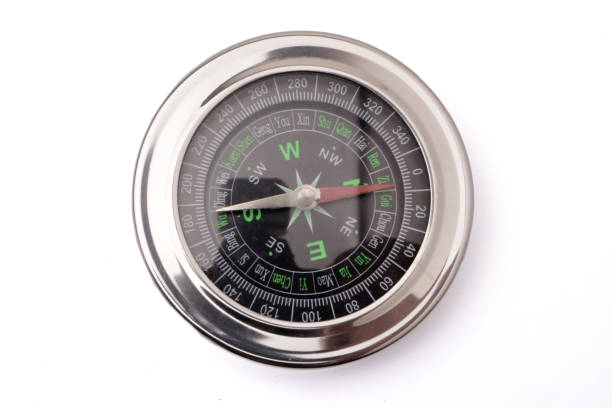istock Magnetic silver metal compass on white background 1372670701