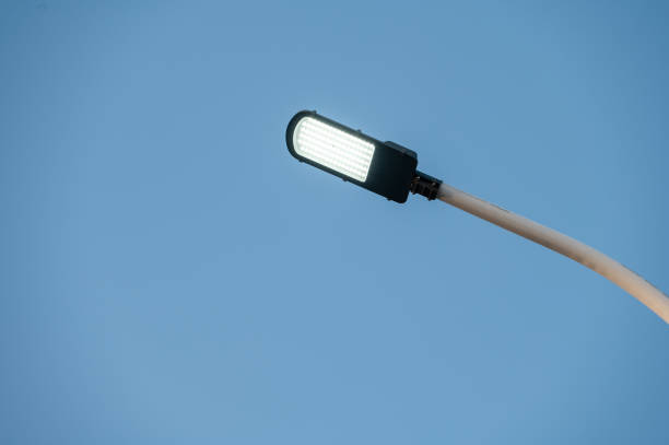 istock LED street lights lit under the blue sky 1372674919