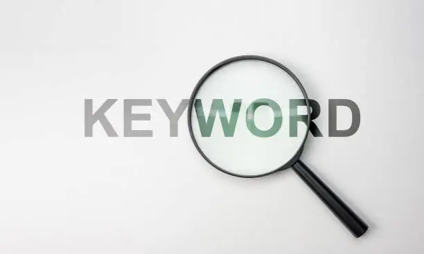 Photo of Find keywords concept. Keywords analysis. Highly Effective Keywords for a Search Engine Optimized Website. Search Engine Optimization. white background