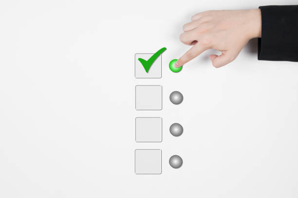 istock Hand of a businessman selecting a check mark on a white background. 1372678703