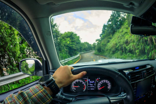 istock People driving car on mountain road 1372685738