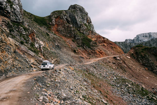 istock Driving off road car on high altitude mountain top 1372689183