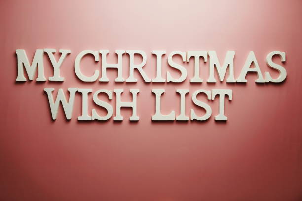 istock Christmas Wish List alphabet letter on pink background 1372693169