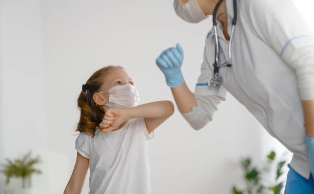 istock Doctor and child wearing facemasks 1372693191