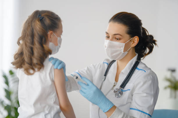 istock Doctor vaccinating child 1372693195