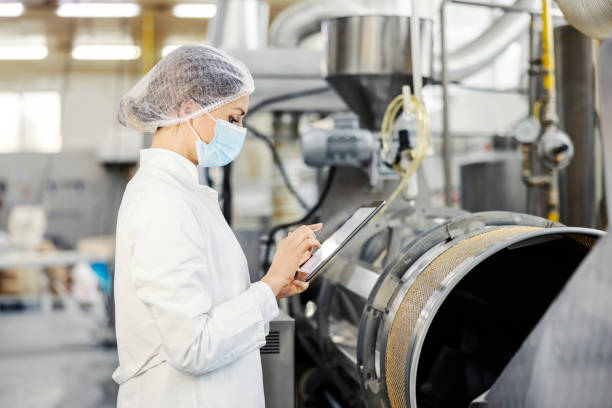 istock A food factory inspector scrolling on tablet while standing next to a boiler. 1372694670