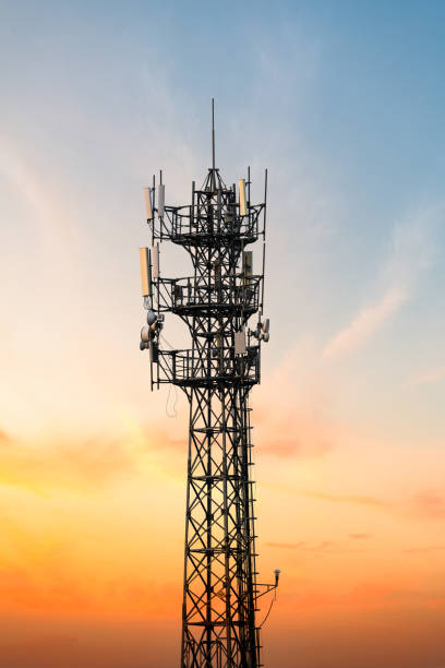 5G Sunset Cell Tower: Cellular communications tower for mobile phone and video data transmission