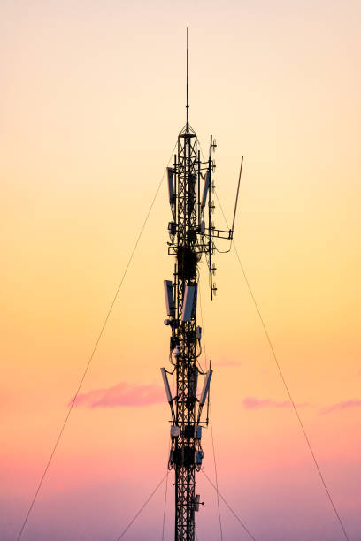 istock 5G Sunset Cell Tower: Cellular communications tower for mobile phone and video data transmission 1372695661