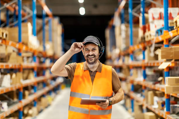 istock A delivery service man with voice picking headset and tablet is ready for work. 1372696346