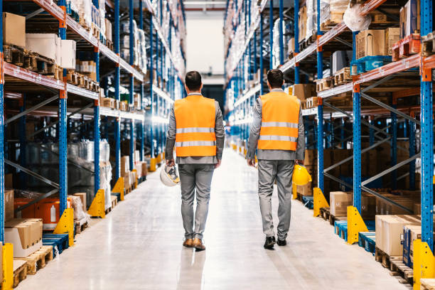 istock Rear view of two business partners dispatching storage. 1372698995