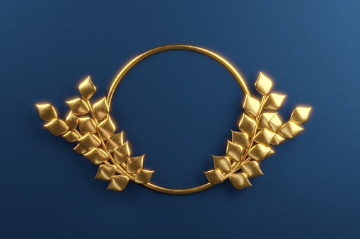 Golden Wreath placed on a black surface.